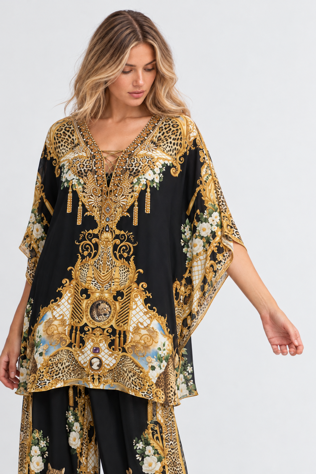 Midnight Romance Butterfly Top showing its flowing butterfly sleeves and ornate gold, leopard and floral motifs